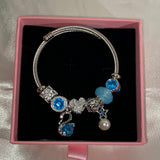 Pulsera de dijes de plata